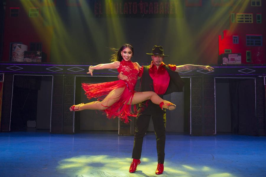 A couple in red at the top of a jump